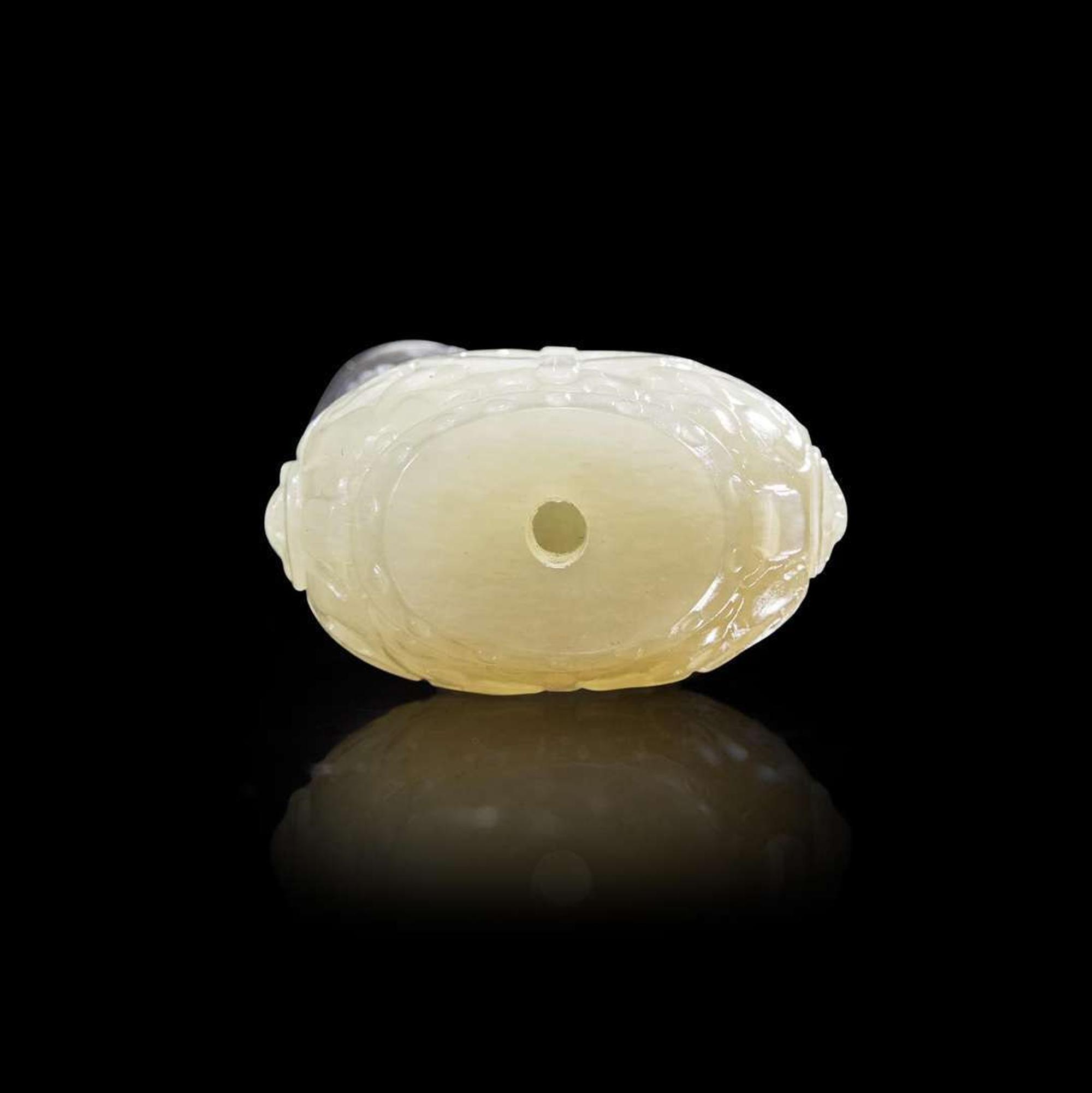 A Chinese carved two-color jade "Cat and Butterfly on Garden Stool" toggle “貓蝶”俏色玉雕一件