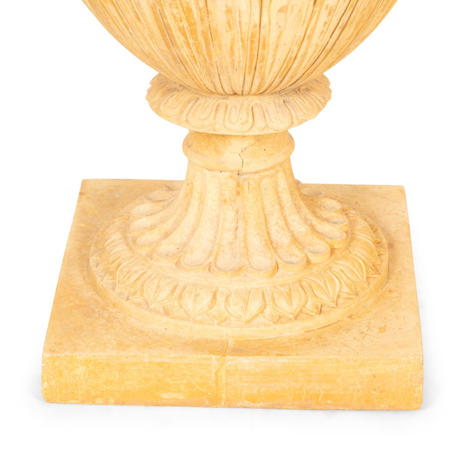 A Pair of Cast Terra Cotta Covered Garden Urns on Painted Wood Pedestals