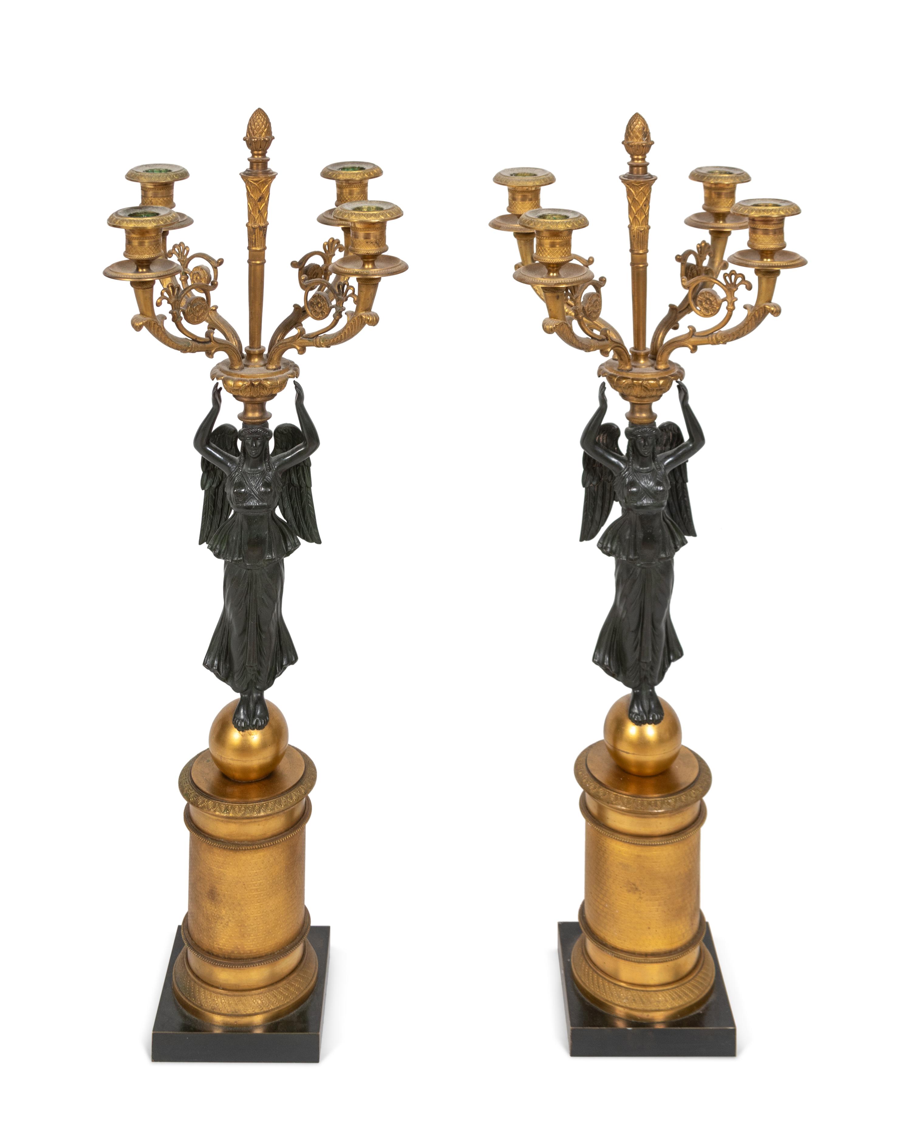 A Pair of Empire Style Parcel-Gilt and Patinated Bronze Four-Light Candelabra