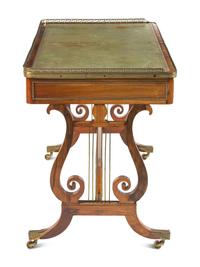A Regency Brass Mounted Rosewood and Rosewood Grained Writing Table