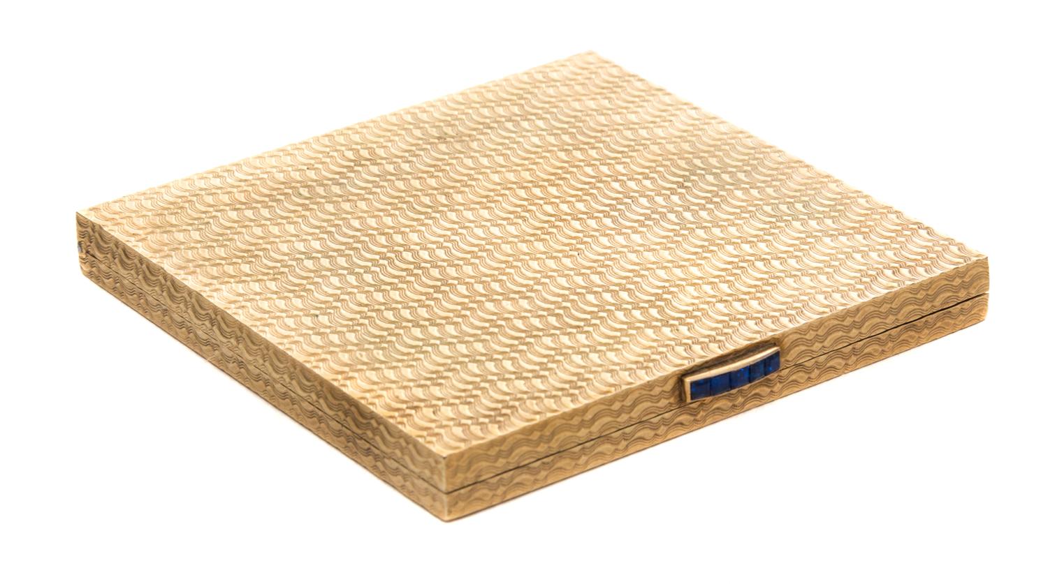 A 9-Karat and Sapphire Compact Width 2 3/8 inches.
