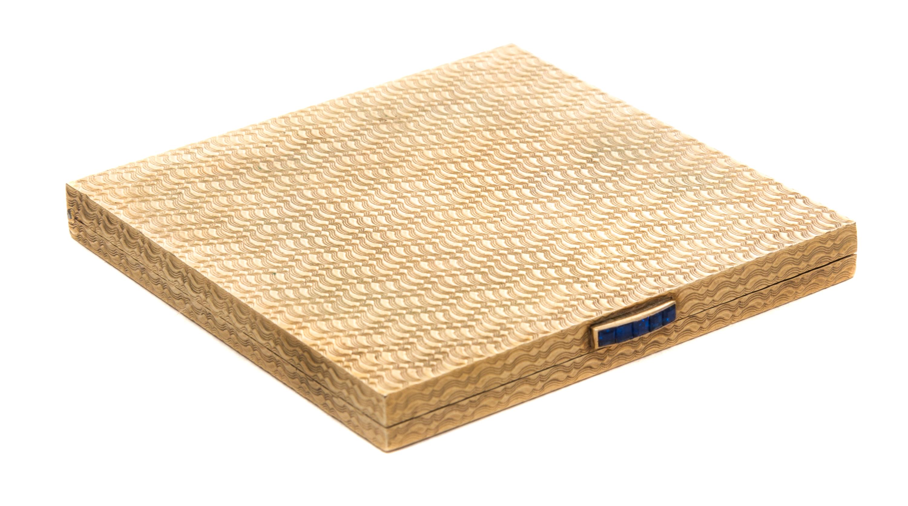 A 9-Karat and Sapphire Compact Width 2 3/8 inches.