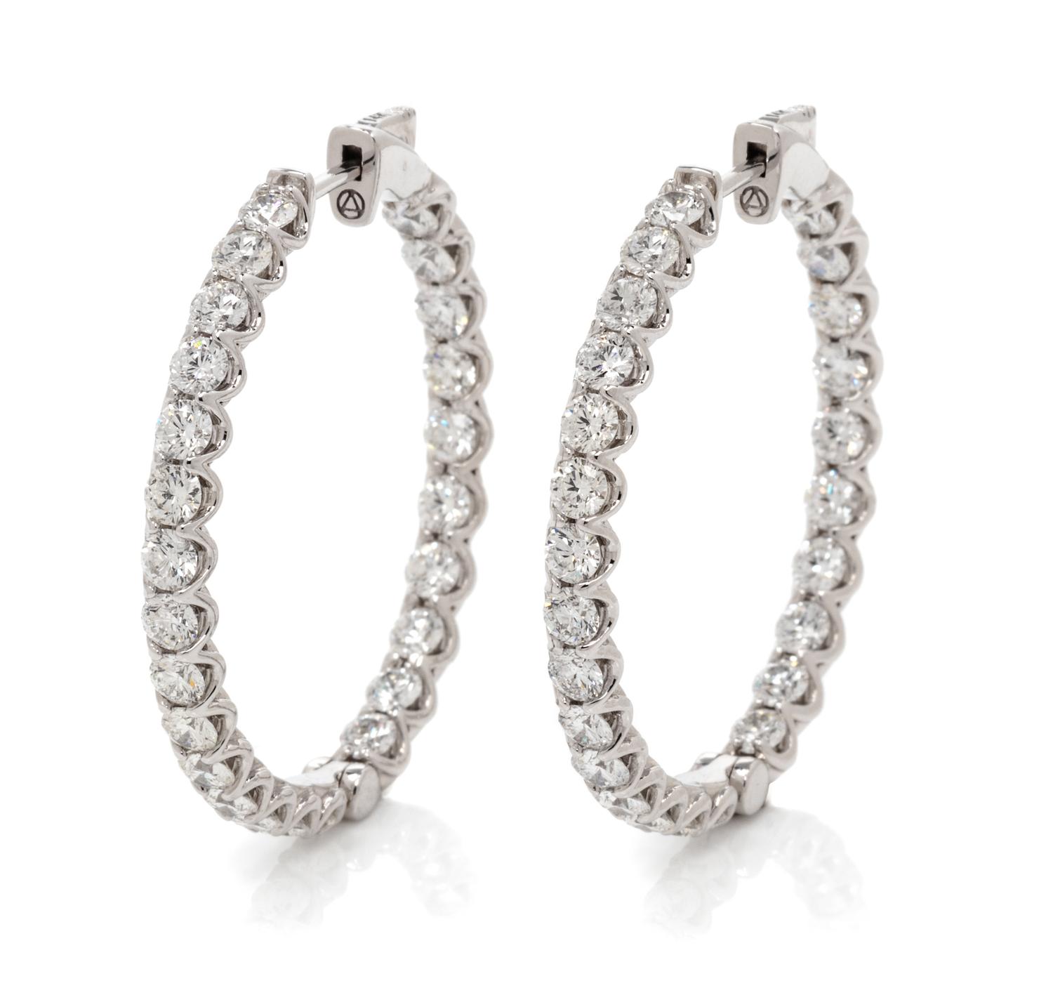 A Pair of 14 Karat White Gold and Diamond Hoop Earrings, 7.85 dwts.