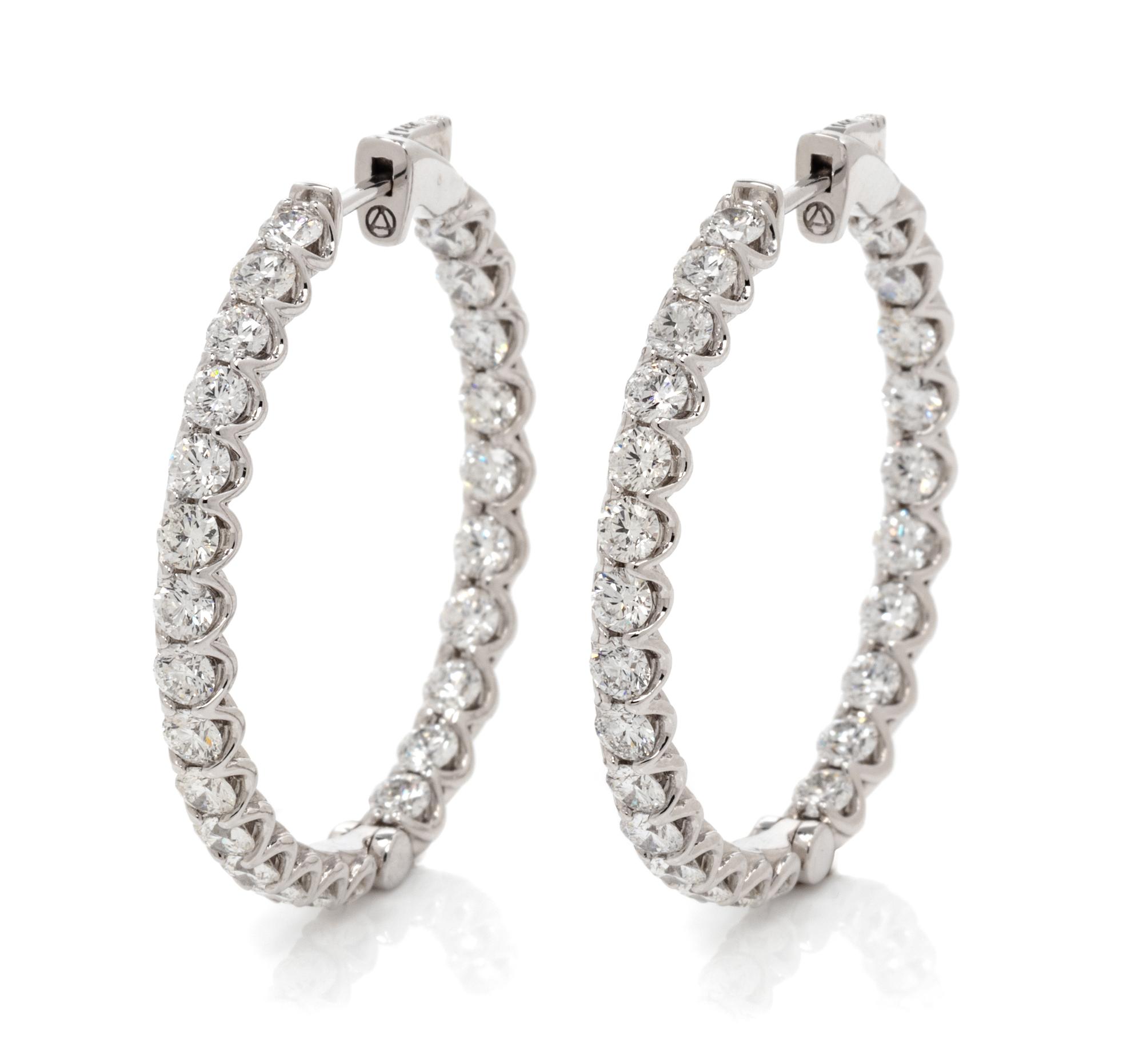 A Pair of 14 Karat White Gold and Diamond Hoop Earrings, 7.85 dwts.