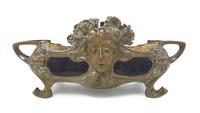 An Art Nouveau Bronze and Ceramic Jardiniere Width over handles 25 1/2 inches.