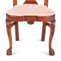 A Set of Four Queen Anne Style Shell and Volute Carved Cherrywood Compass-Seat Claw-and-Ball Foot Side Chairs