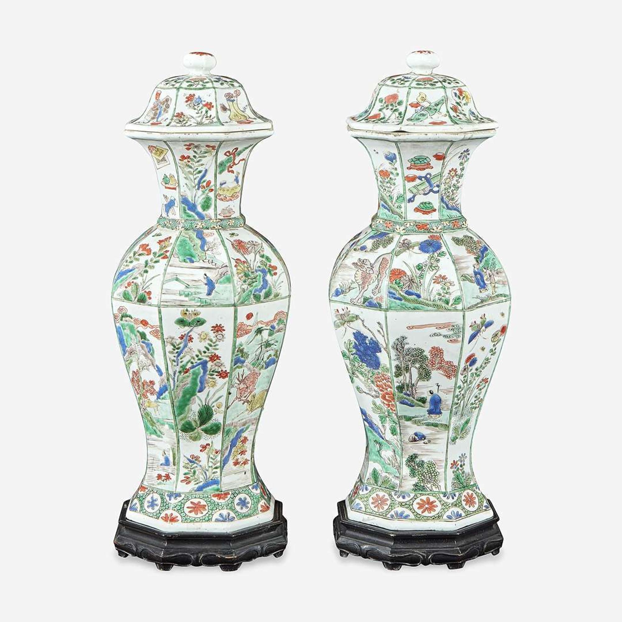 A pair of Chinese famille verte-decorated octagonal baluster vases and covers Kangxi period