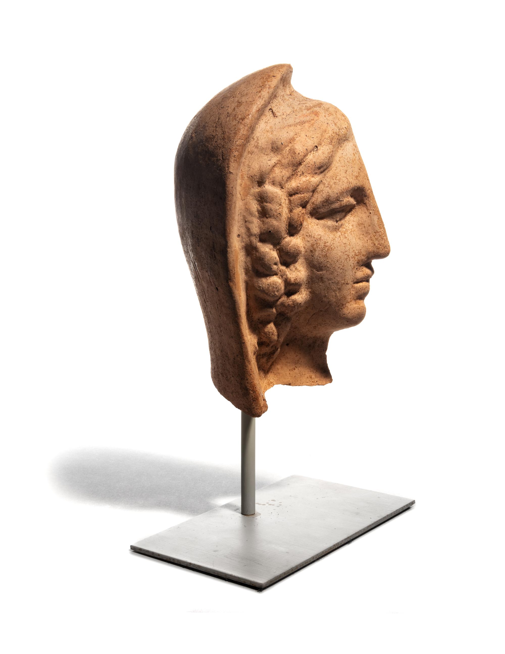 An Etruscan Terra Cotta Votive Half Head