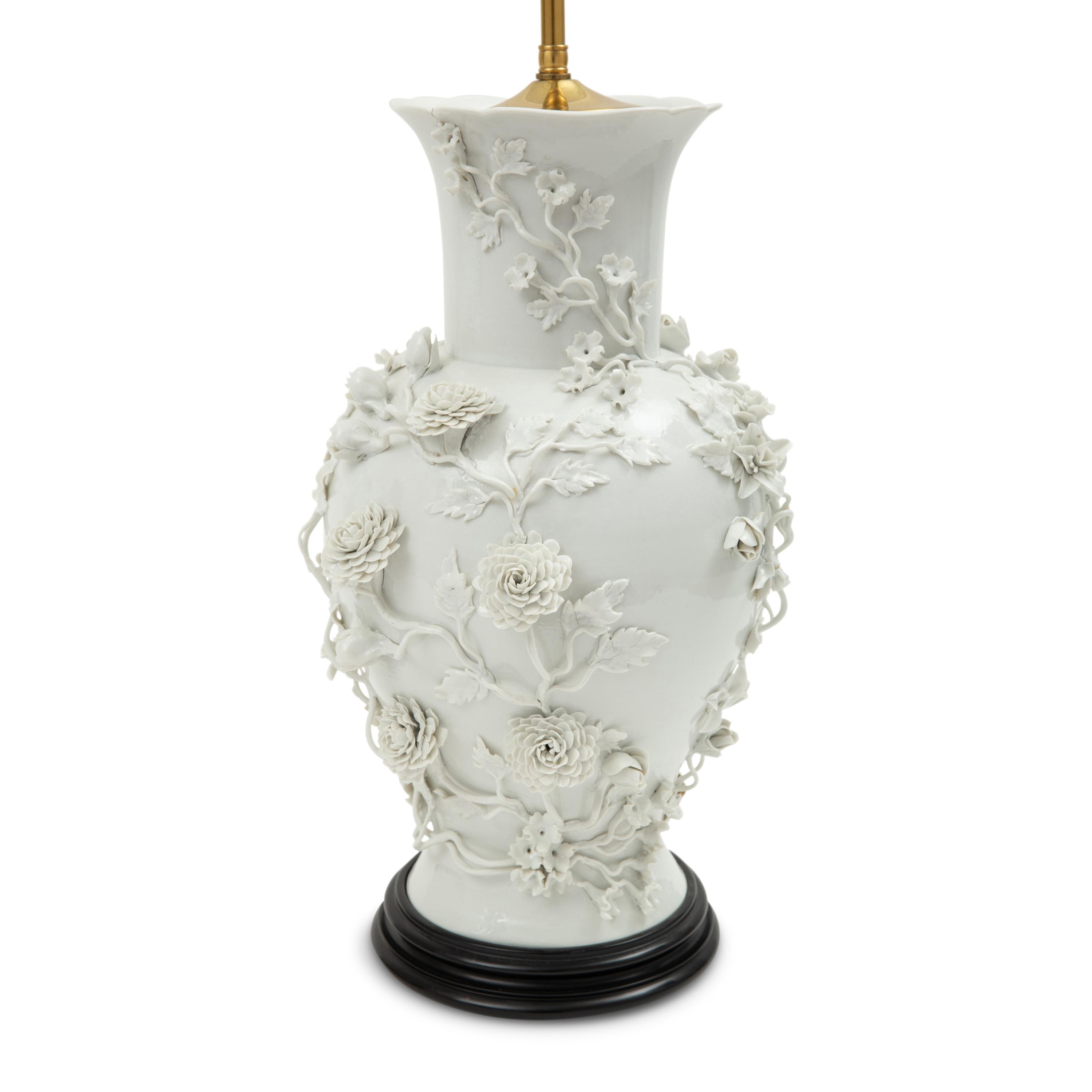 A Pair of Blanc de Chine Floral Porcelain Vases Mounted as Lamps