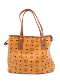 An MCM Cognac Reversible Liz Visetos Shopper Tote, 12" H x 13" W x 6" D; Strap drop: 8.75".