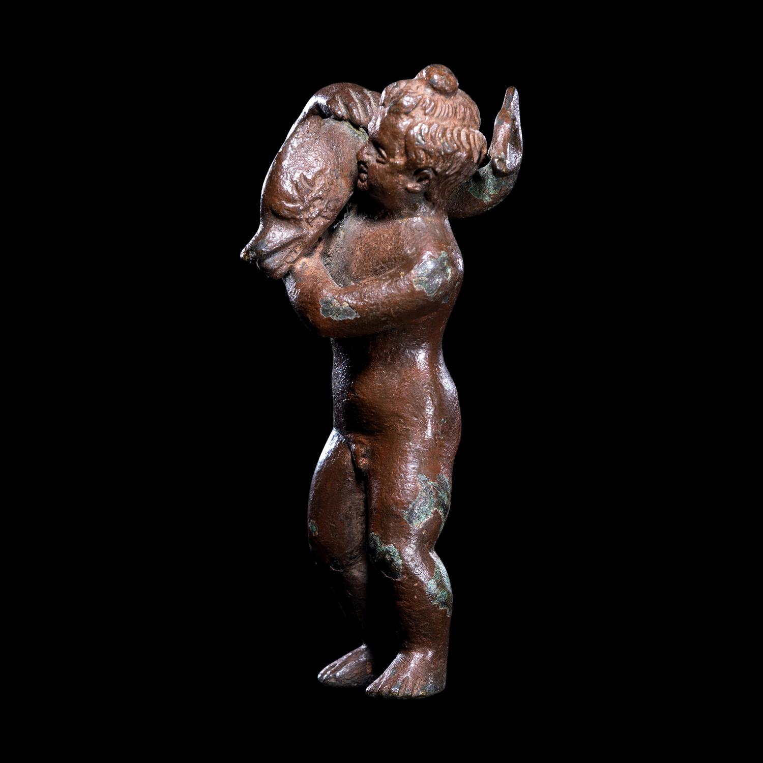 A Roman Bronze Eros with a Dolphin