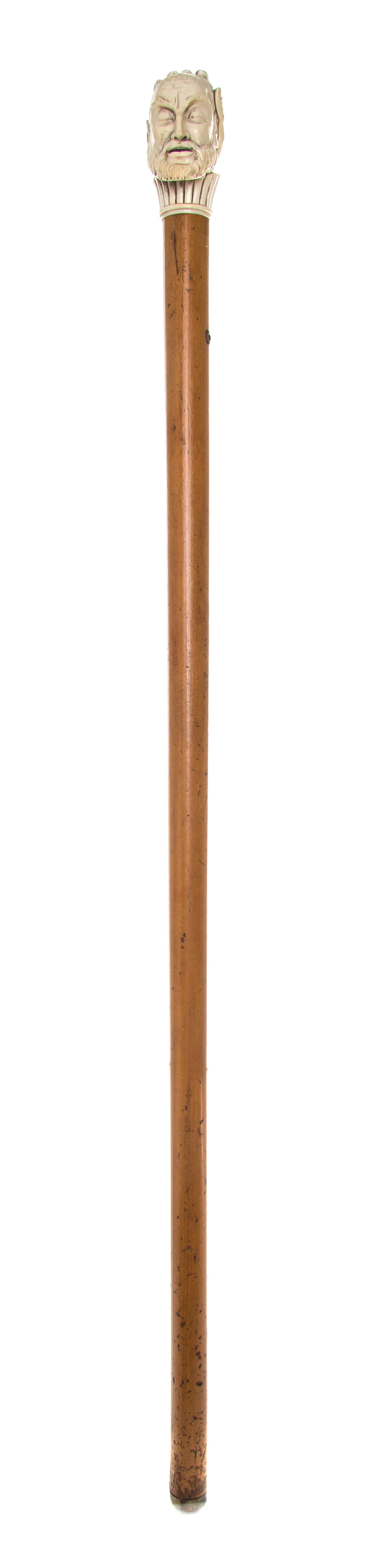 An English Ivory Handled Walking Stick, Length of handle 3 1/2 x length overall 36 7/8 inches.