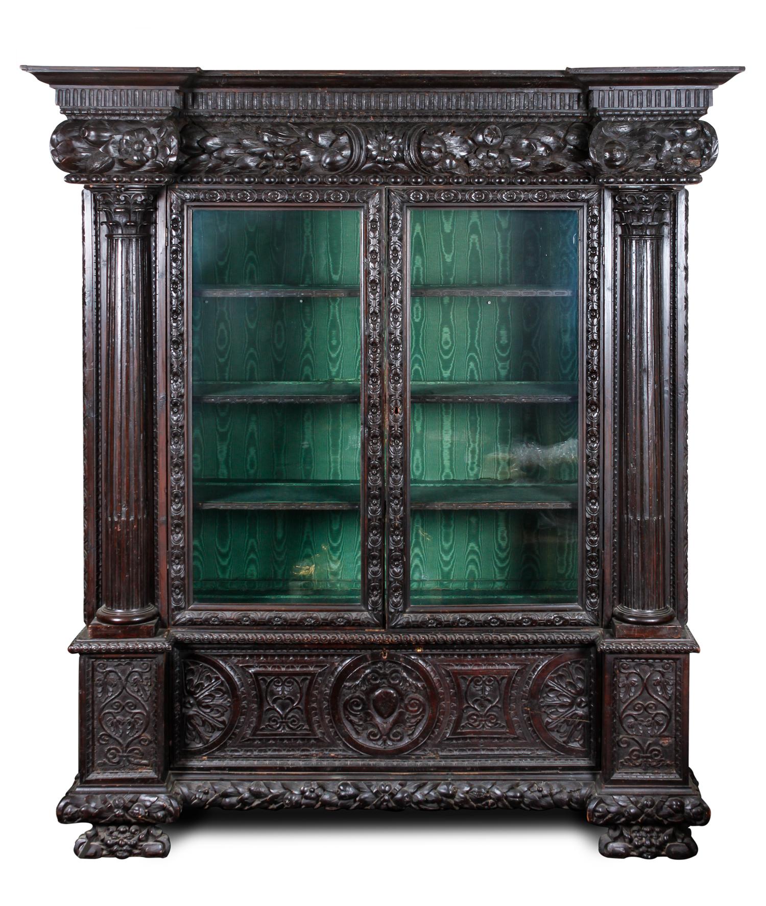 A Continental Carved Oak Display Cabinet Height 86 1/4 x width 70 x depth 25 1/2 inches.
