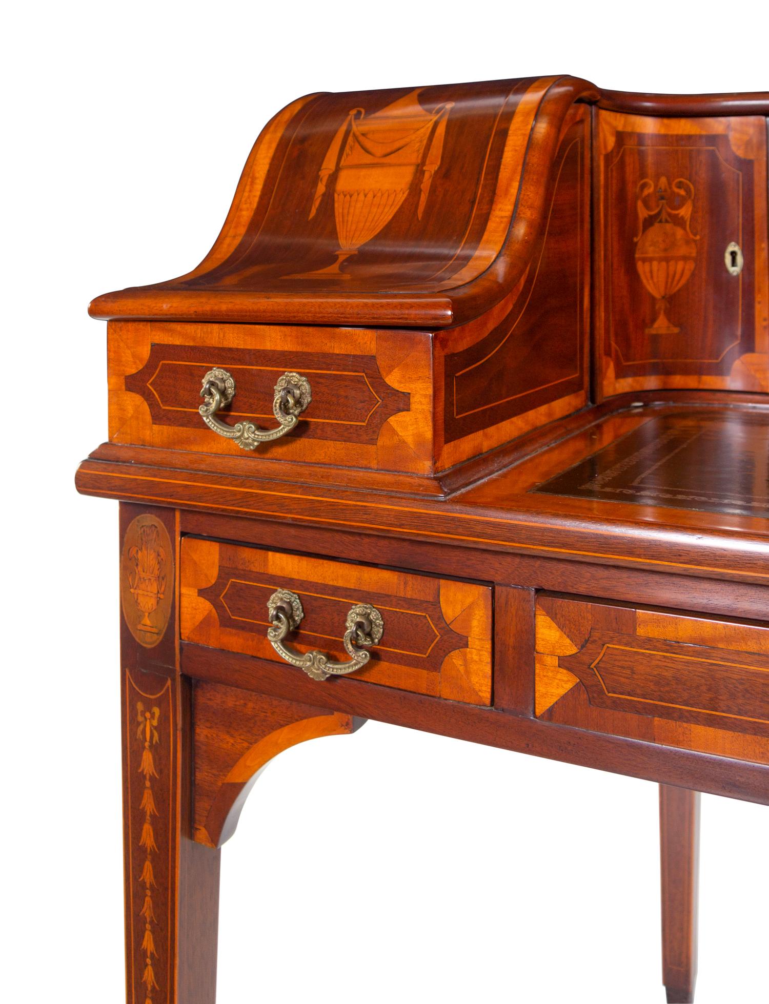 A George III Style Inlaid and Figured Mahogany Leather Inset Carlton House Desk