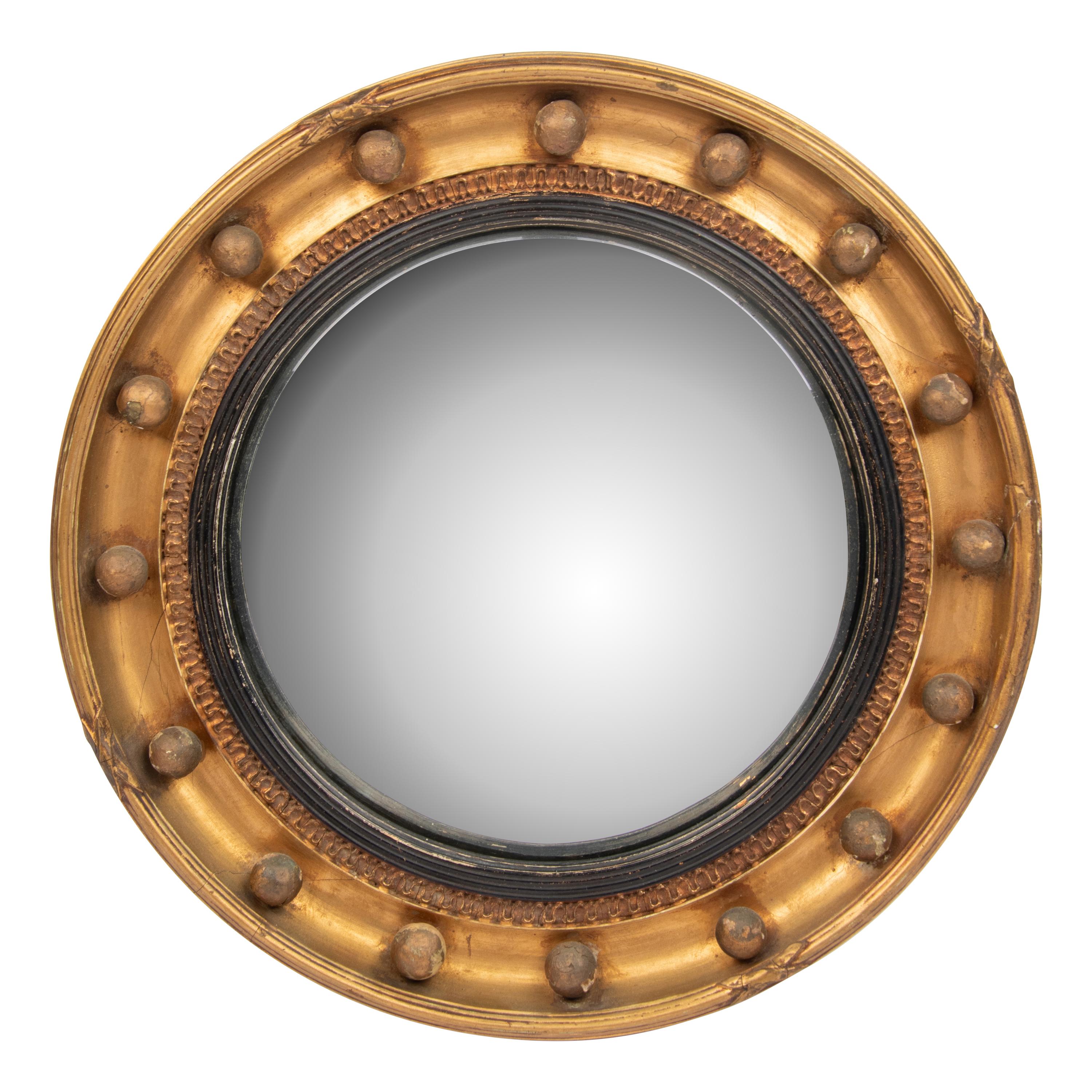 A Regency Giltwood and Part Ebonized Bullseye Mirror