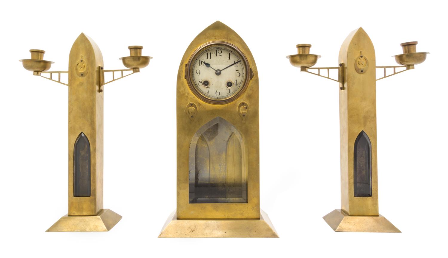 A Secessionist Brass Clock Garniture Height 14 3/8 inches.