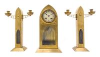 A Secessionist Brass Clock Garniture Height 14 3/8 inches.