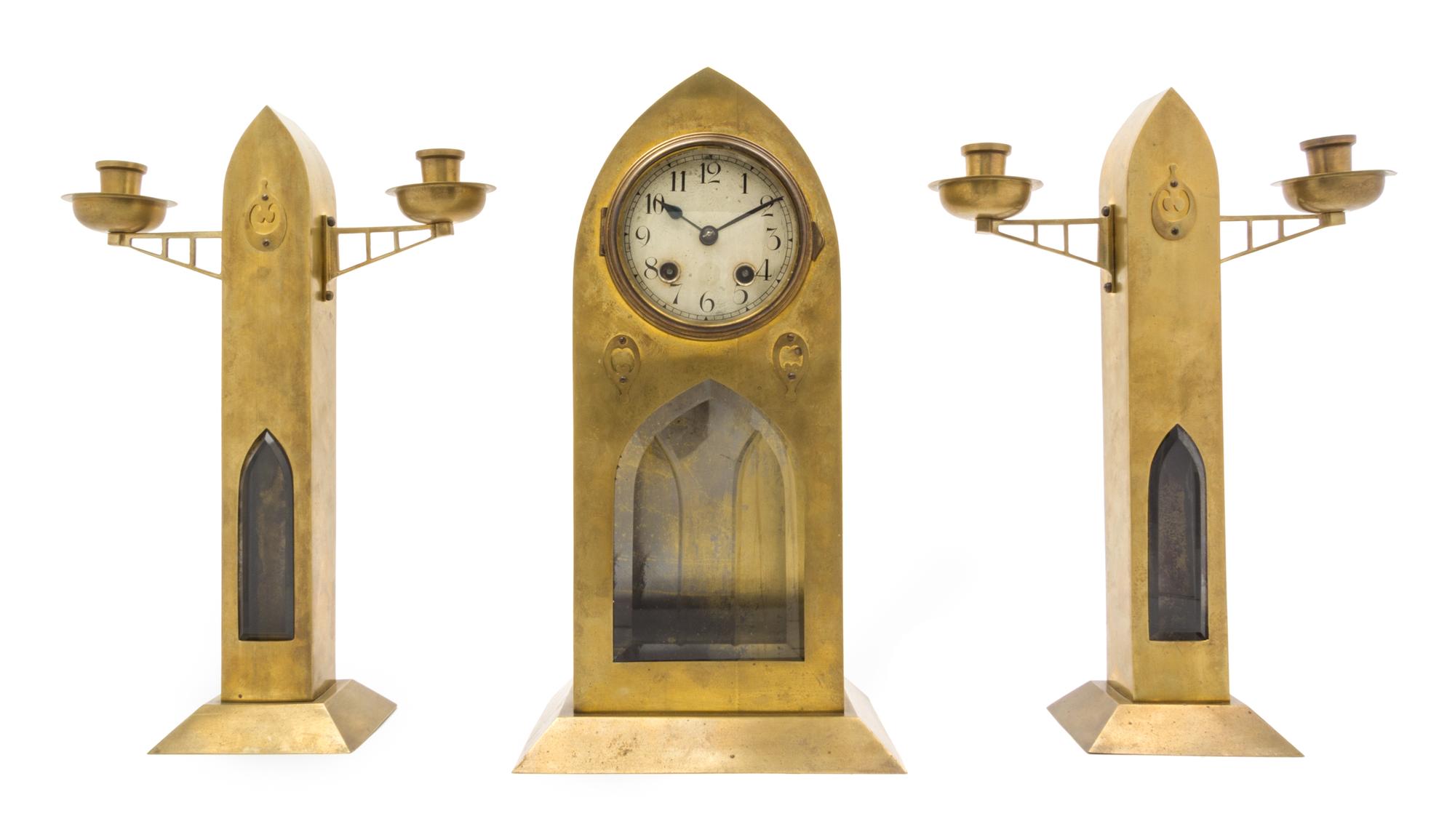 A Secessionist Brass Clock Garniture Height 14 3/8 inches.