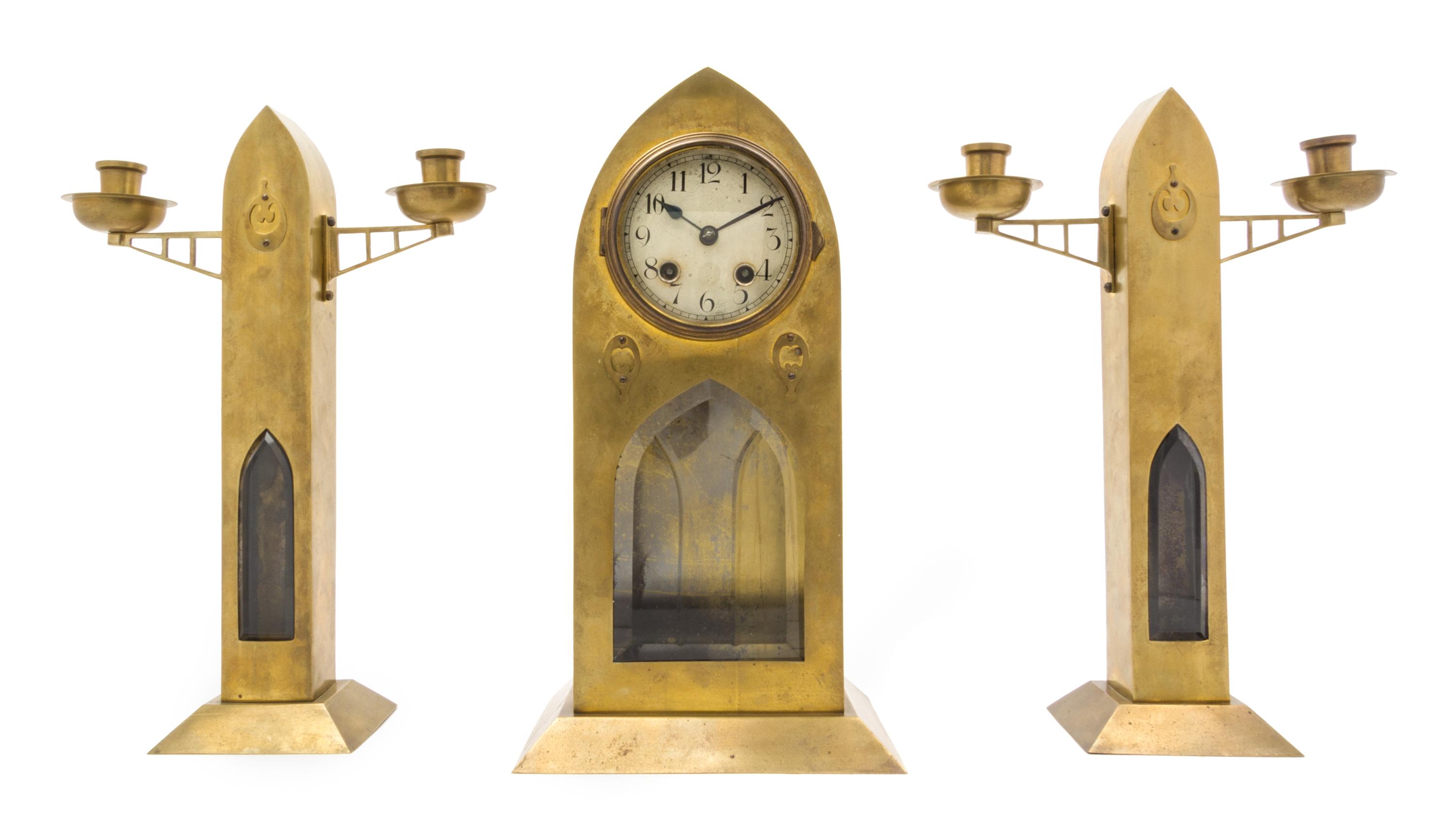 A Secessionist Brass Clock Garniture Height 14 3/8 inches.