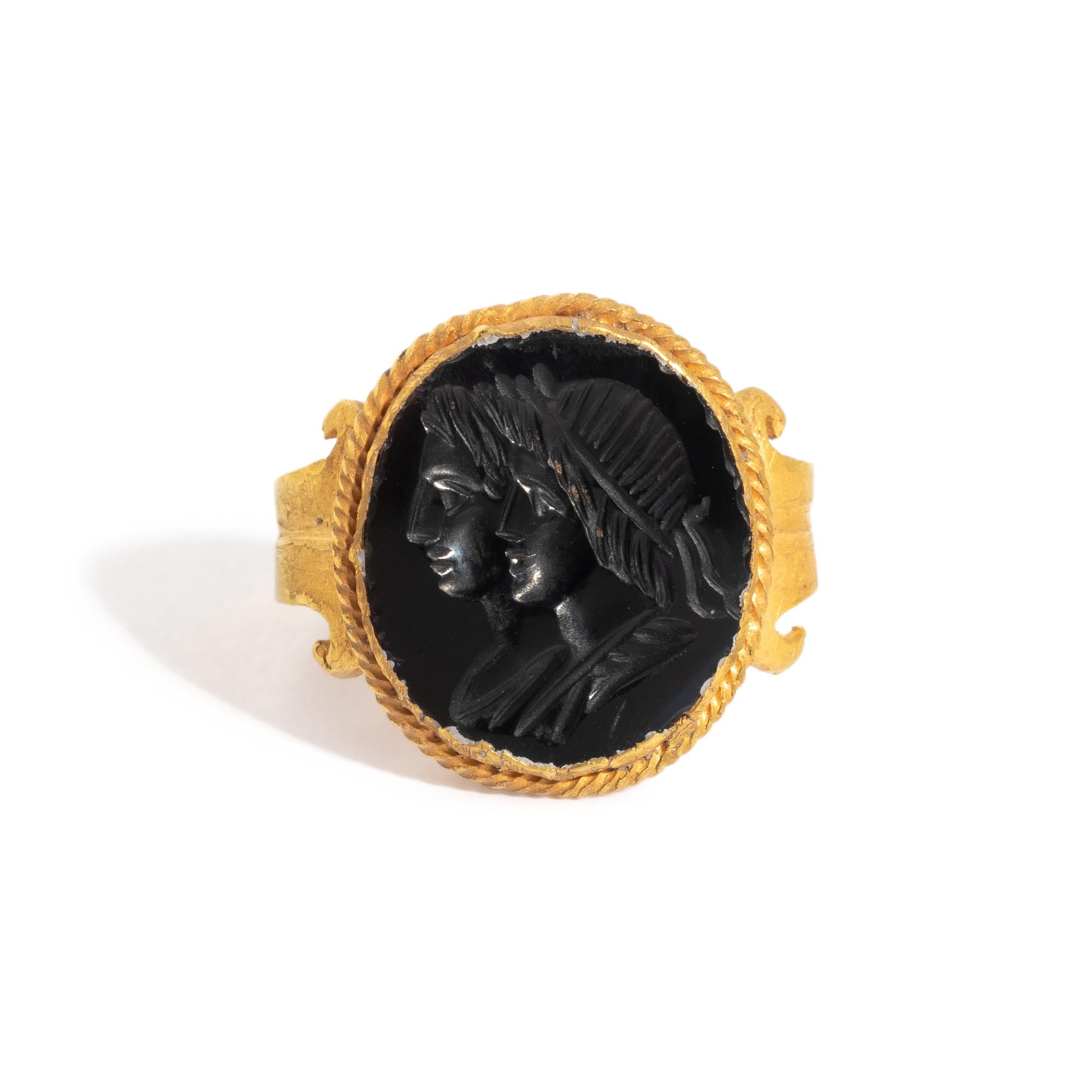 A Neoclassical Gold and Black Onyx Finger Ring with a Double Portrait