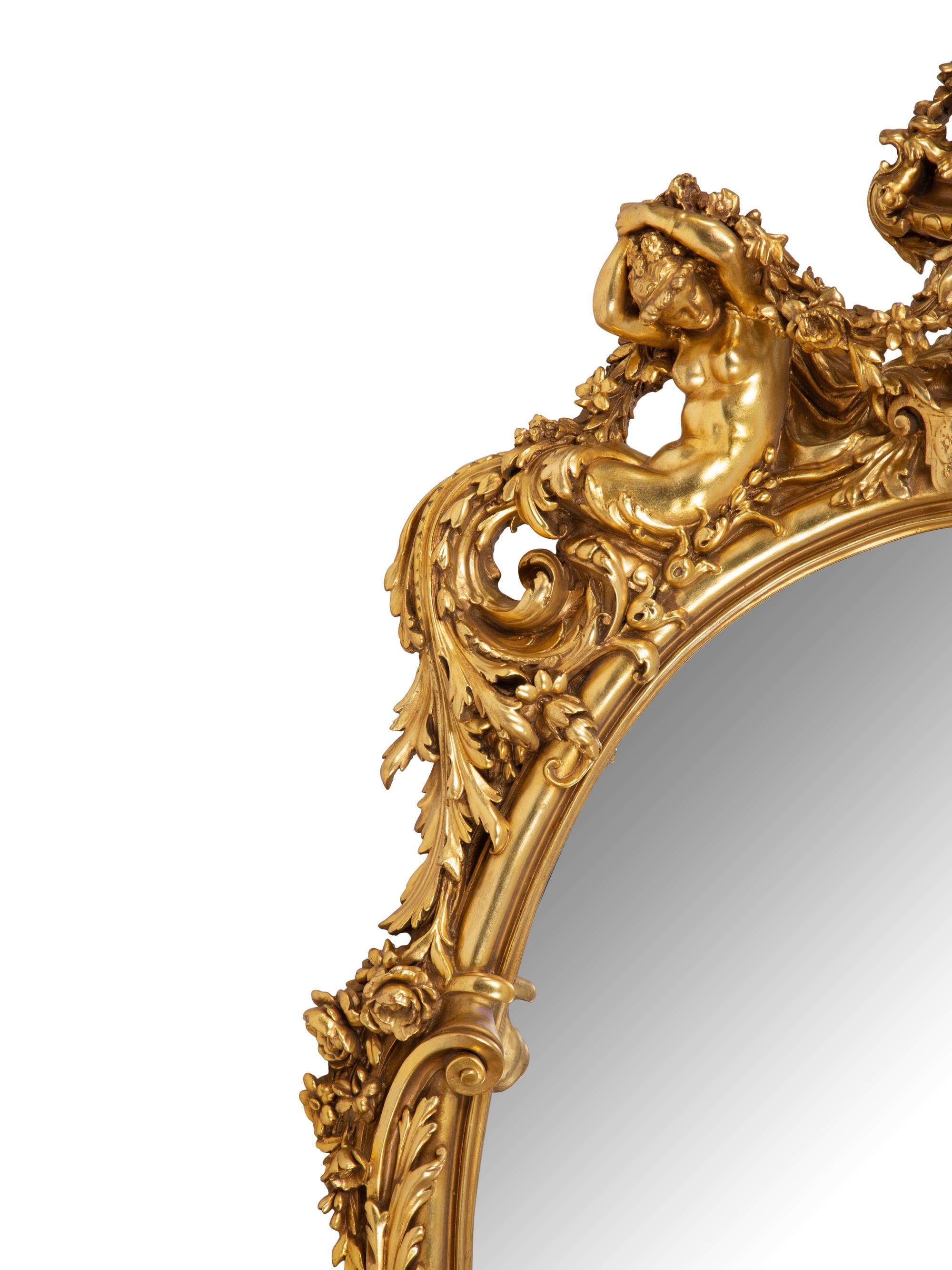 A Pair of Italian Baroque Carved Giltwood Oval Mirrors — 19TH CENTURY
