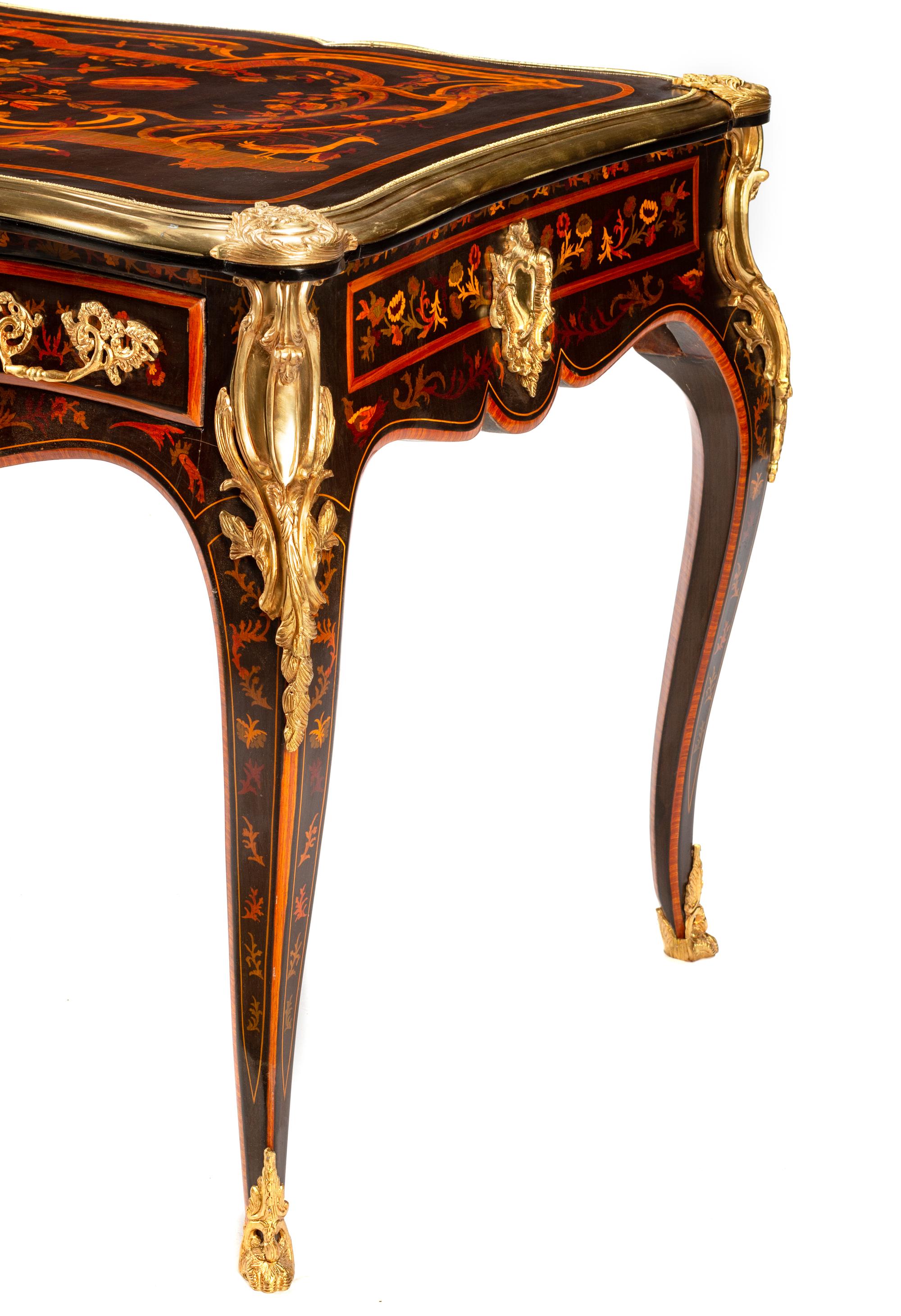 A Louis XV Style Gilt Bronze Mounted Marquetry Bureau Plat