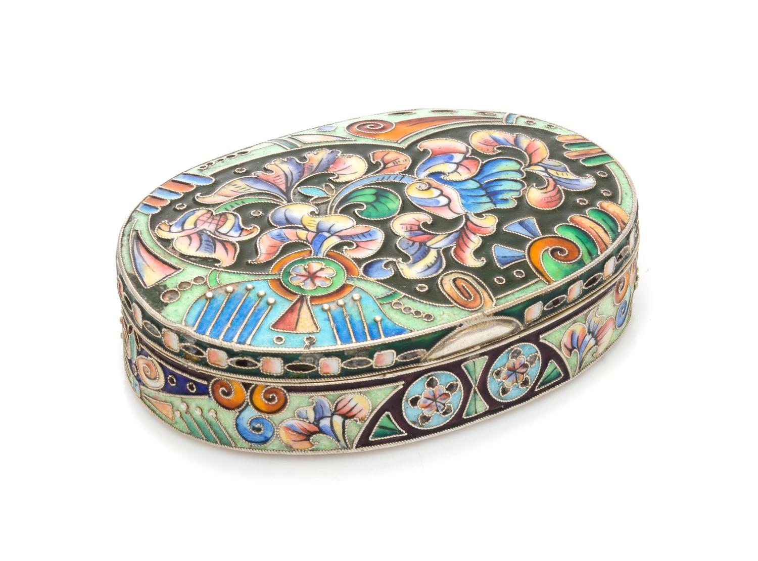 A Russian Enameled Silver Snuff Box, Mark of the 6th Artel, Moscow, Early 20th Century, of oval form, having polychrome enameled foliat