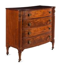 A Federal Carved and Figured Mahogany Bow-Front Chest of Drawers