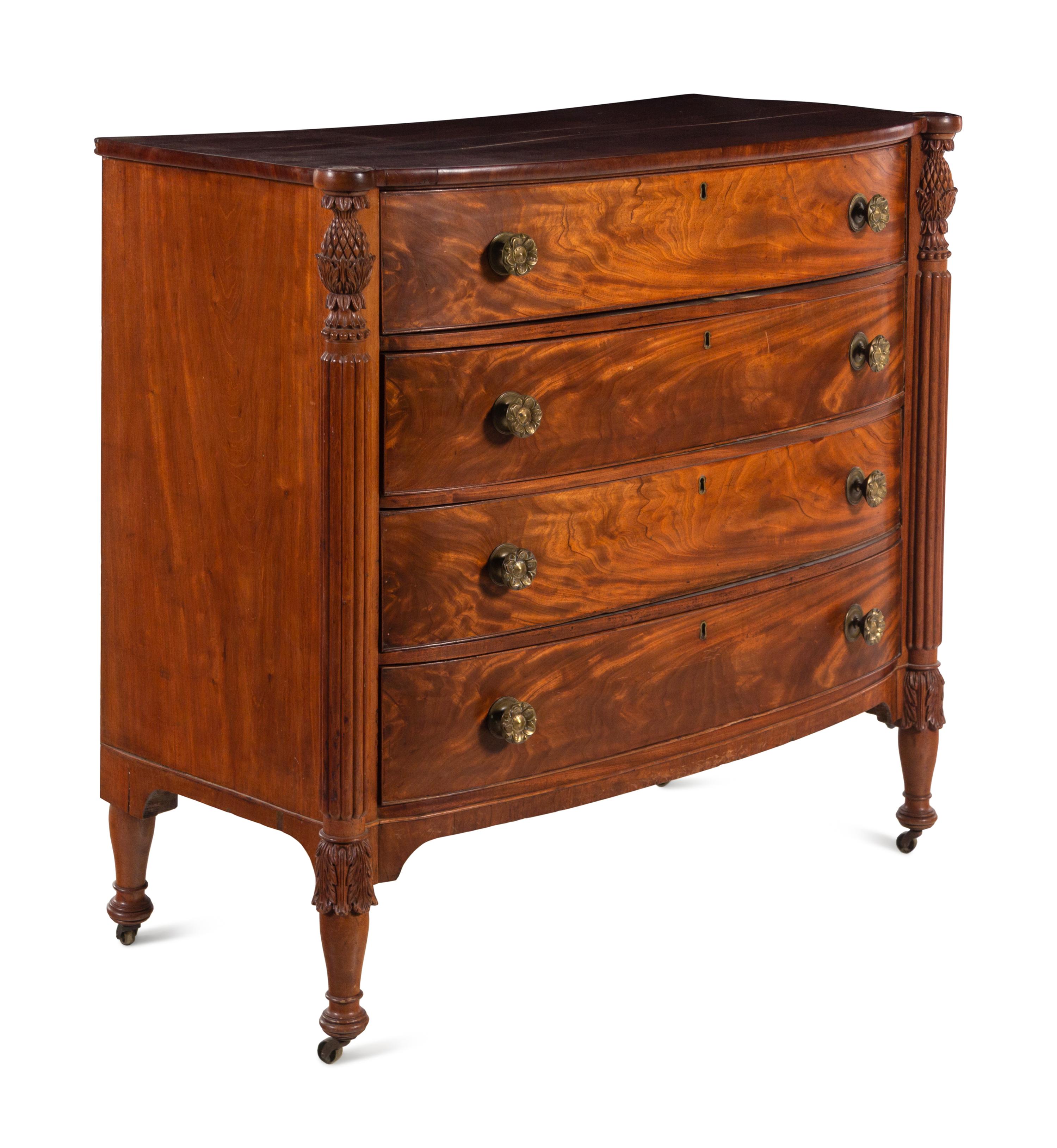 A Federal Carved and Figured Mahogany Bow-Front Chest of Drawers
