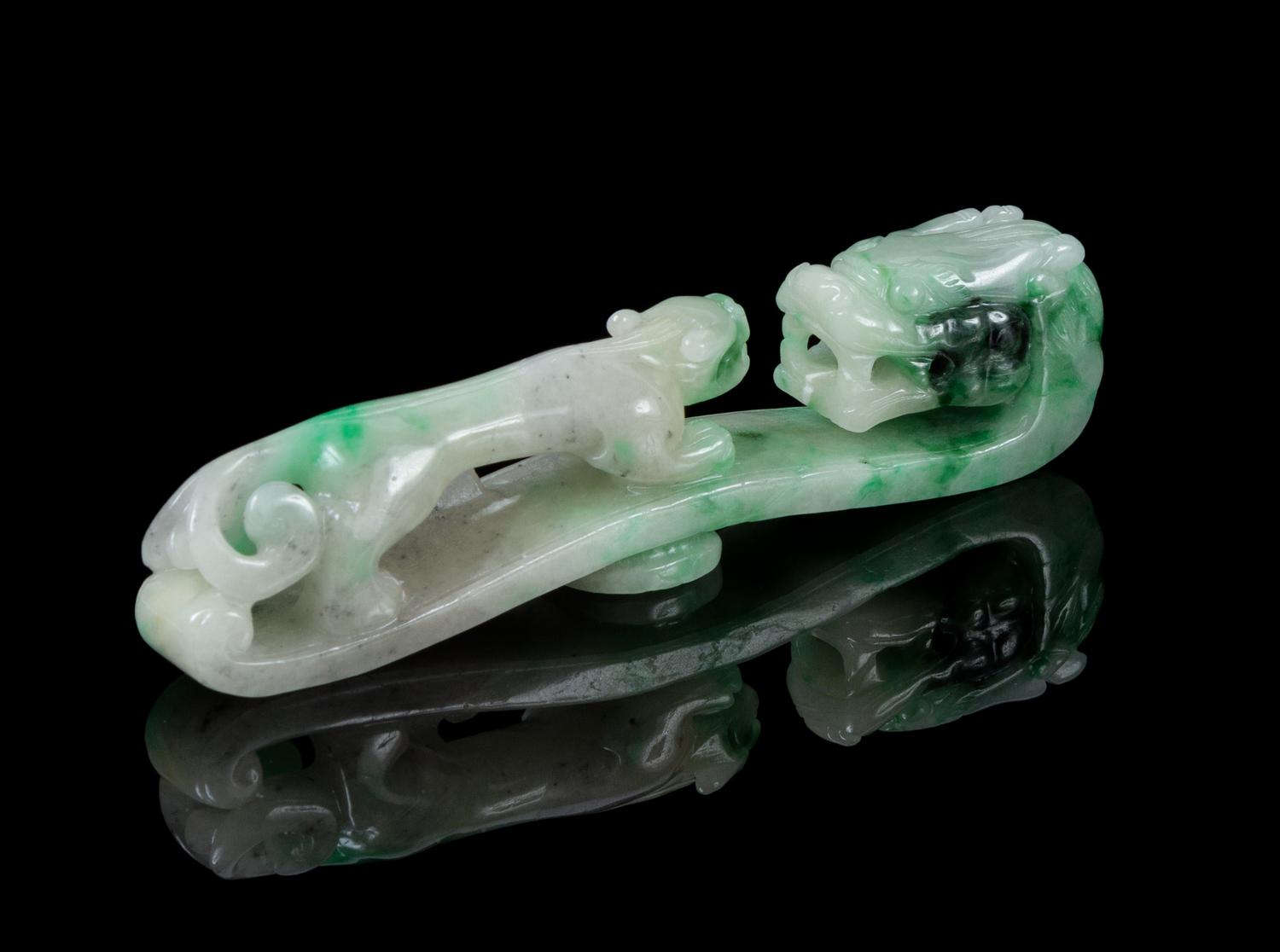 A Carved Jadeite Belt Hook Length 4 1/2 inches.