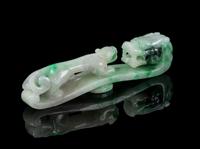A Carved Jadeite Belt Hook Length 4 1/2 inches.