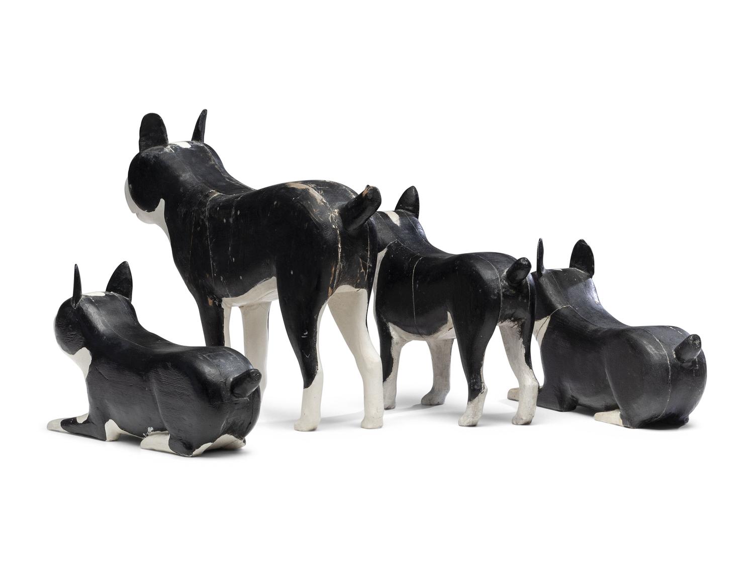A Set of Four Carved and Painted Wood Boston Terrier Figures