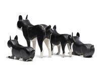 A Set of Four Carved and Painted Wood Boston Terrier Figures