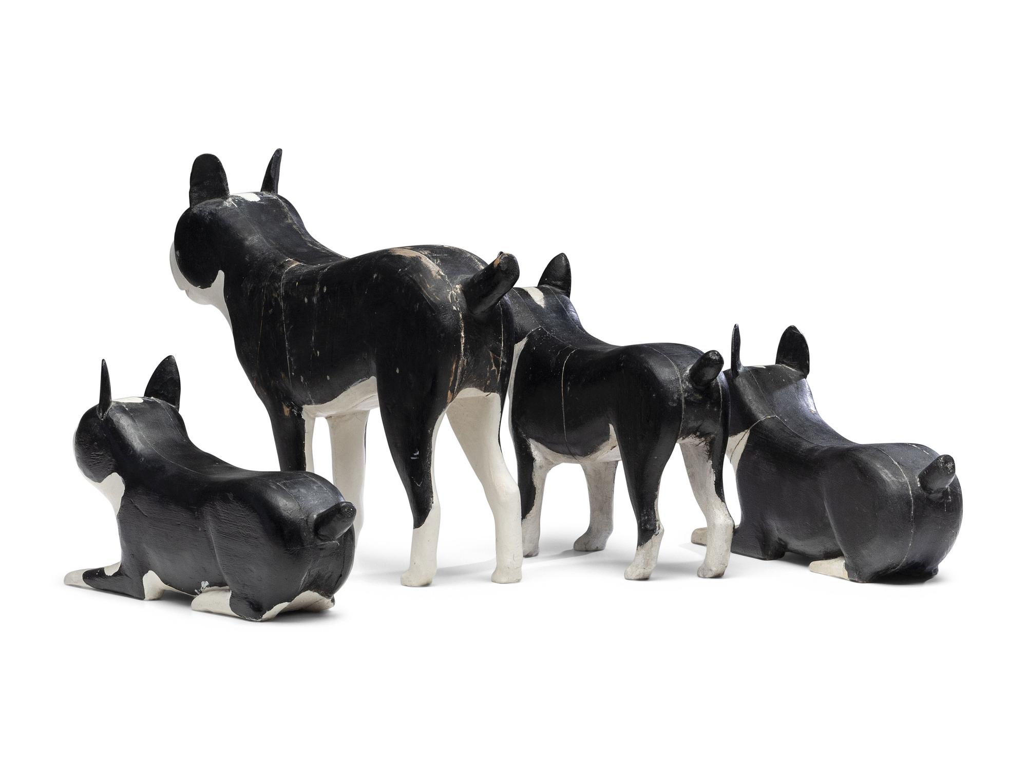 A Set of Four Carved and Painted Wood Boston Terrier Figures