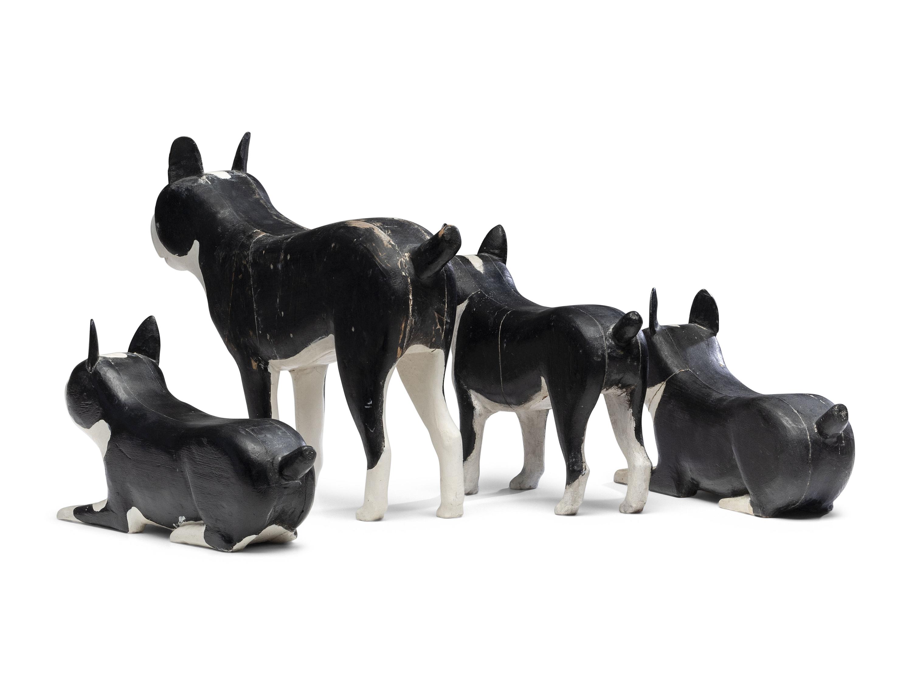 A Set of Four Carved and Painted Wood Boston Terrier Figures