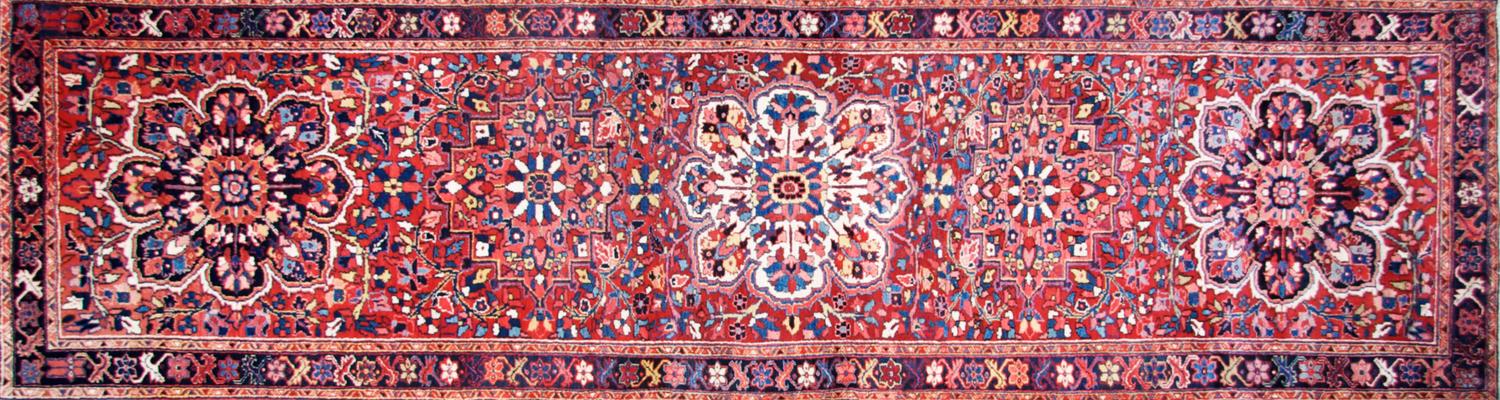 A Heriz Runner. 4 feet x 13 feet 6 inches.
