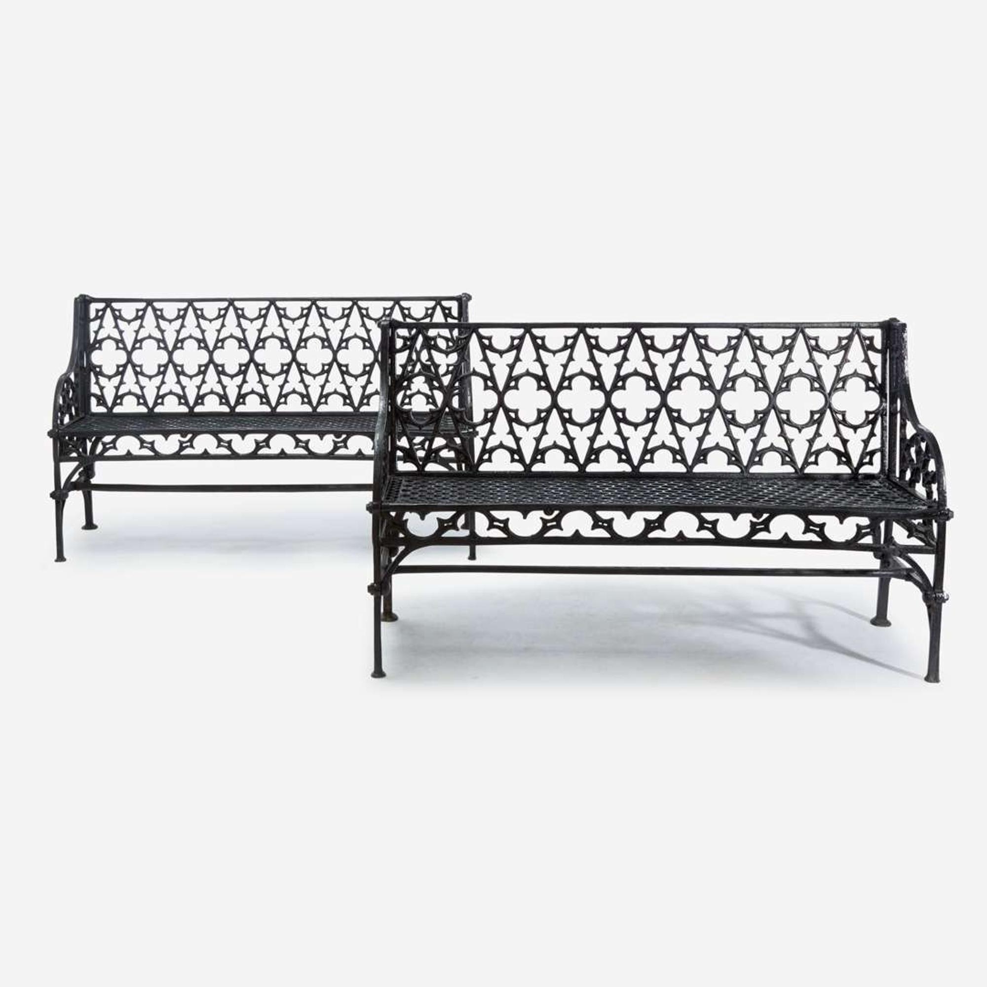 A pair of Gothic Revival black-painted cast iron garden benches 20th century