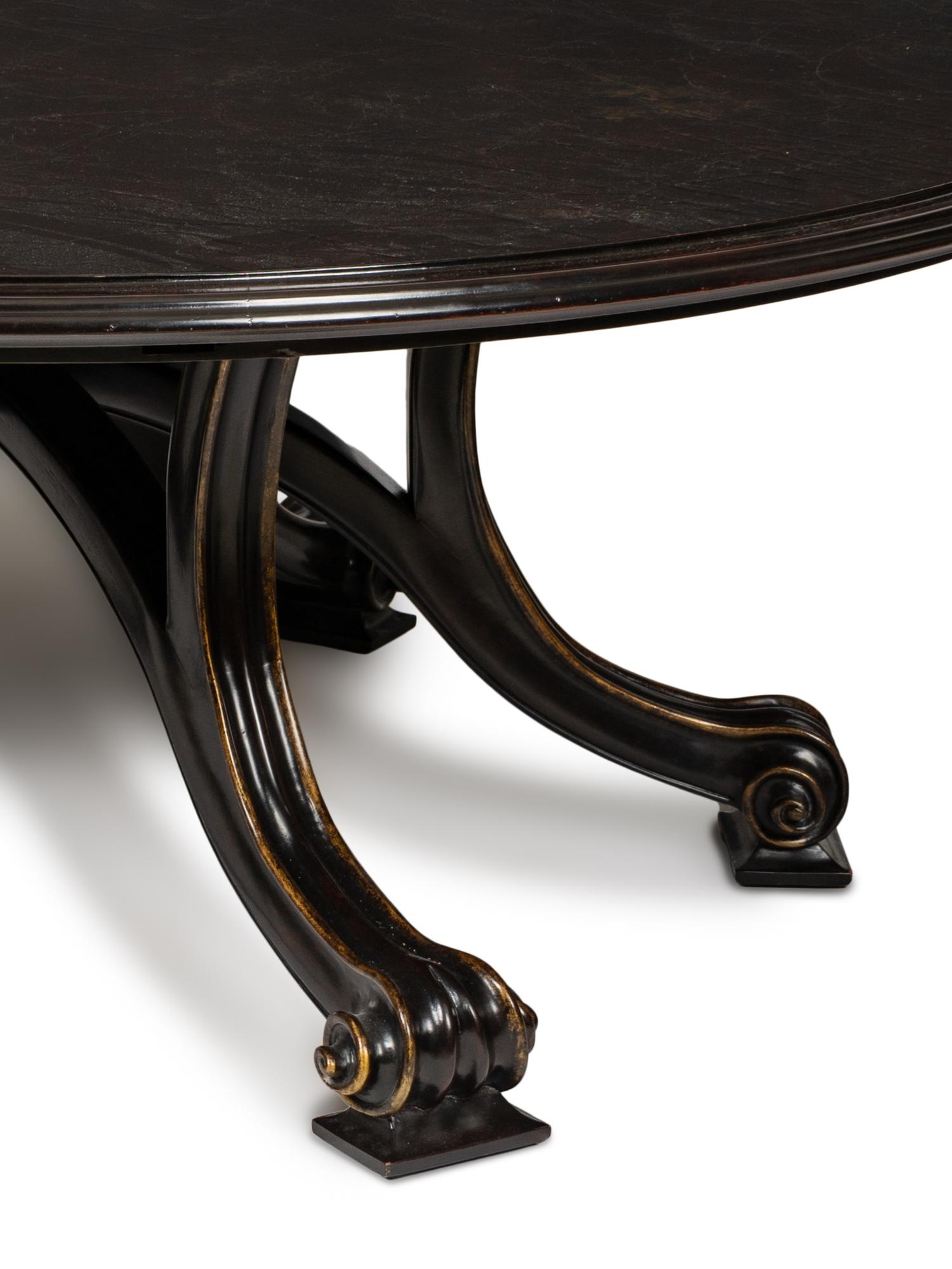 A Therien Studios Ebonized Walnut Volute Circular Extension Dining Table