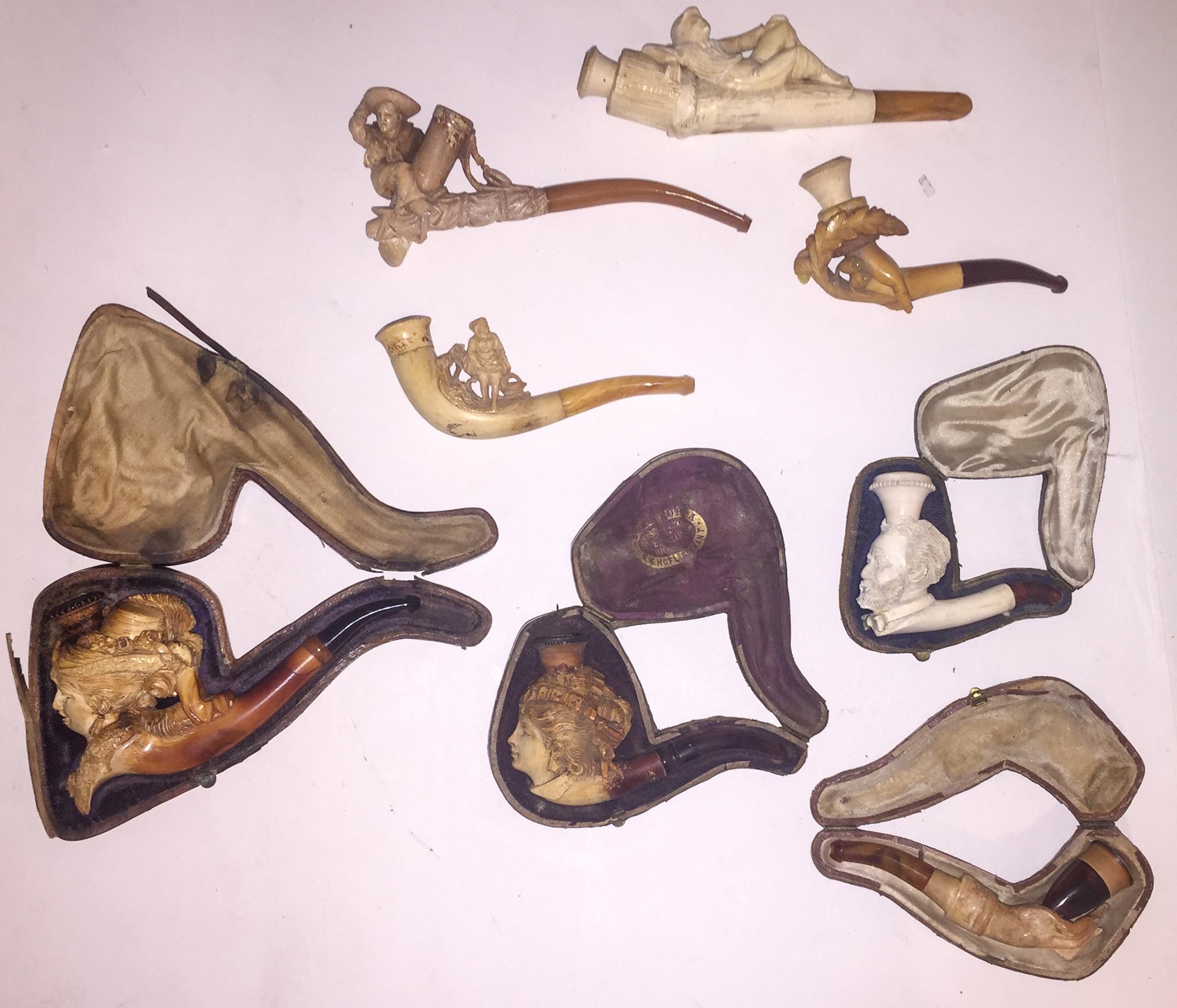 A Collection of Figural Meershaum and Wood Pipes Length of longest 6 inches.