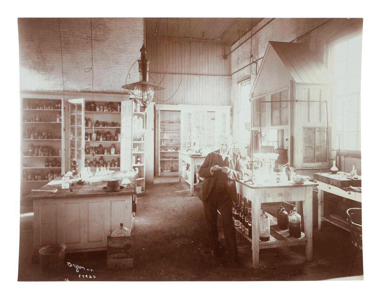 Thomas Edison [EDISON, THOMAS (1847-1931)]. BYRON, Joseph (1847-1923). A portrait of Thomas Edison in his West Orange, NJ laboratory. New York, NY: ca 1904.
