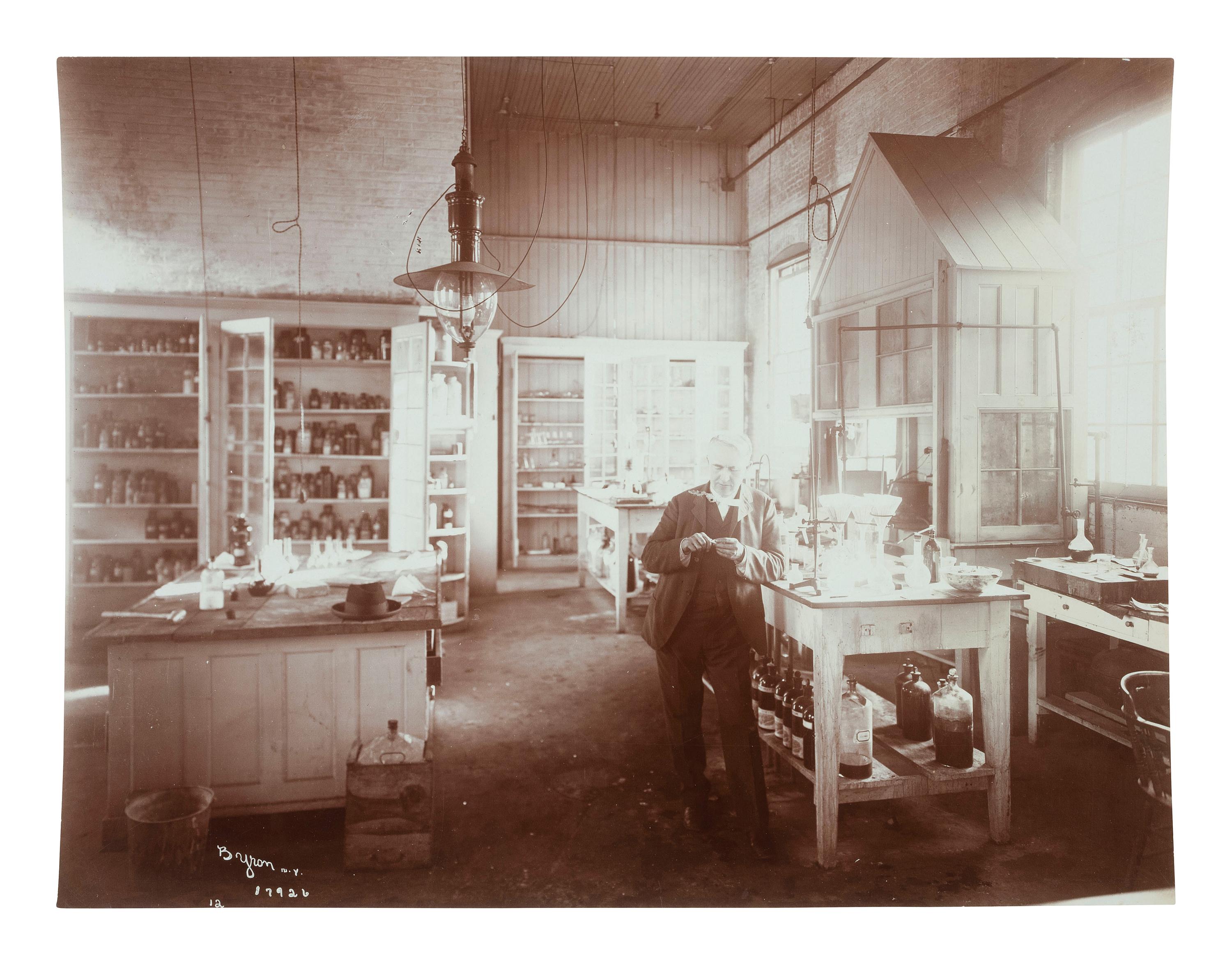 Thomas Edison [EDISON, THOMAS (1847-1931)]. BYRON, Joseph (1847-1923). A portrait of Thomas Edison in his West Orange, NJ laboratory. New York, NY: ca 1904.