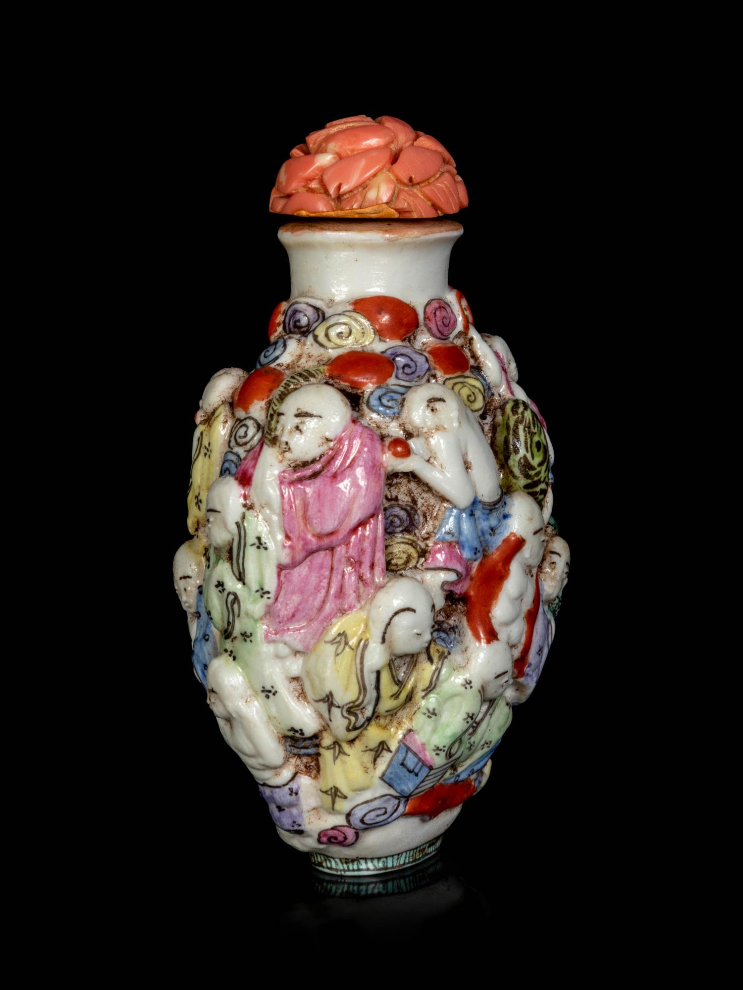 A Chinese Molded Famille Rose Porcelain ‘Luohan’ Snuff Bottle
