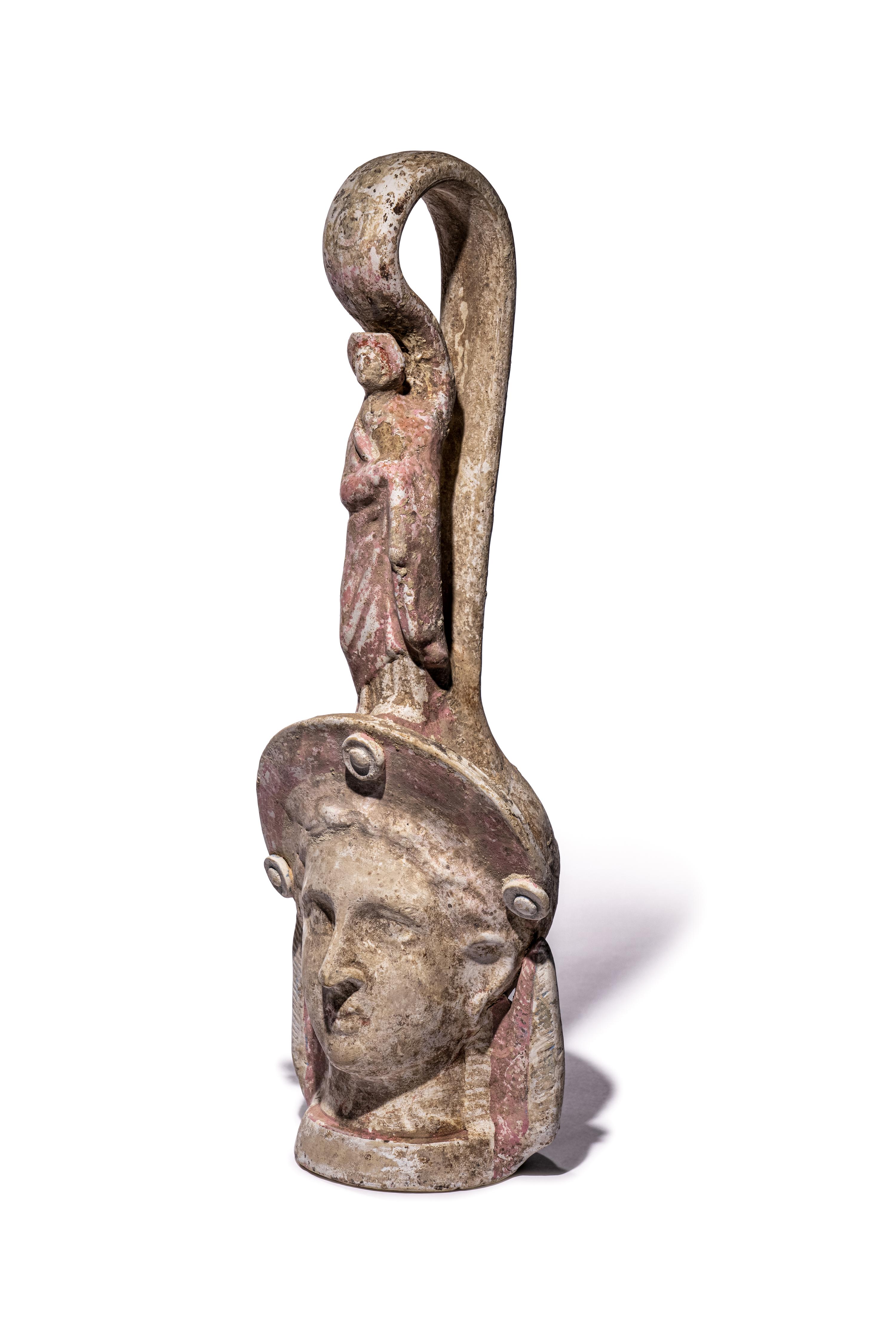 A Canosan Pottery Figural Oinochoe