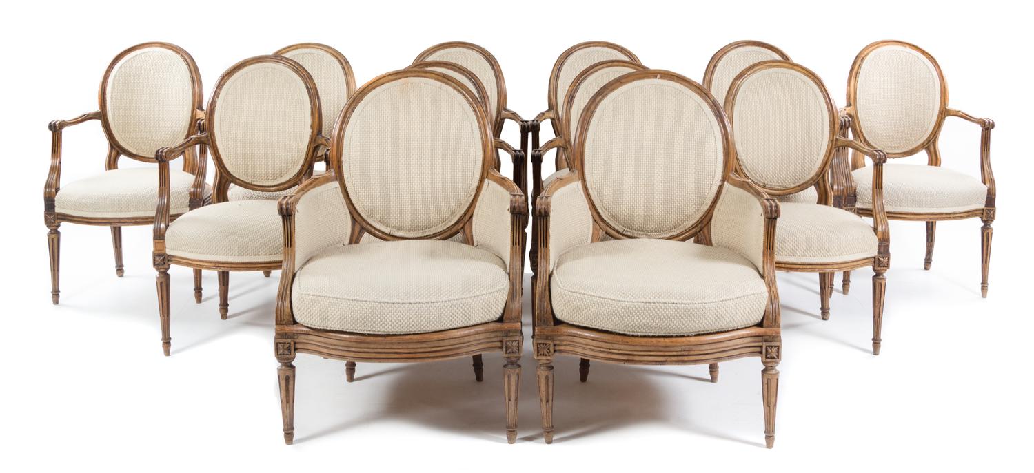 A Set of Twelve Louis XVI Style Dining Chairs Height of tallest 38 1/2 inches. — LATE 19TH/EARLY 20TH CENTURY