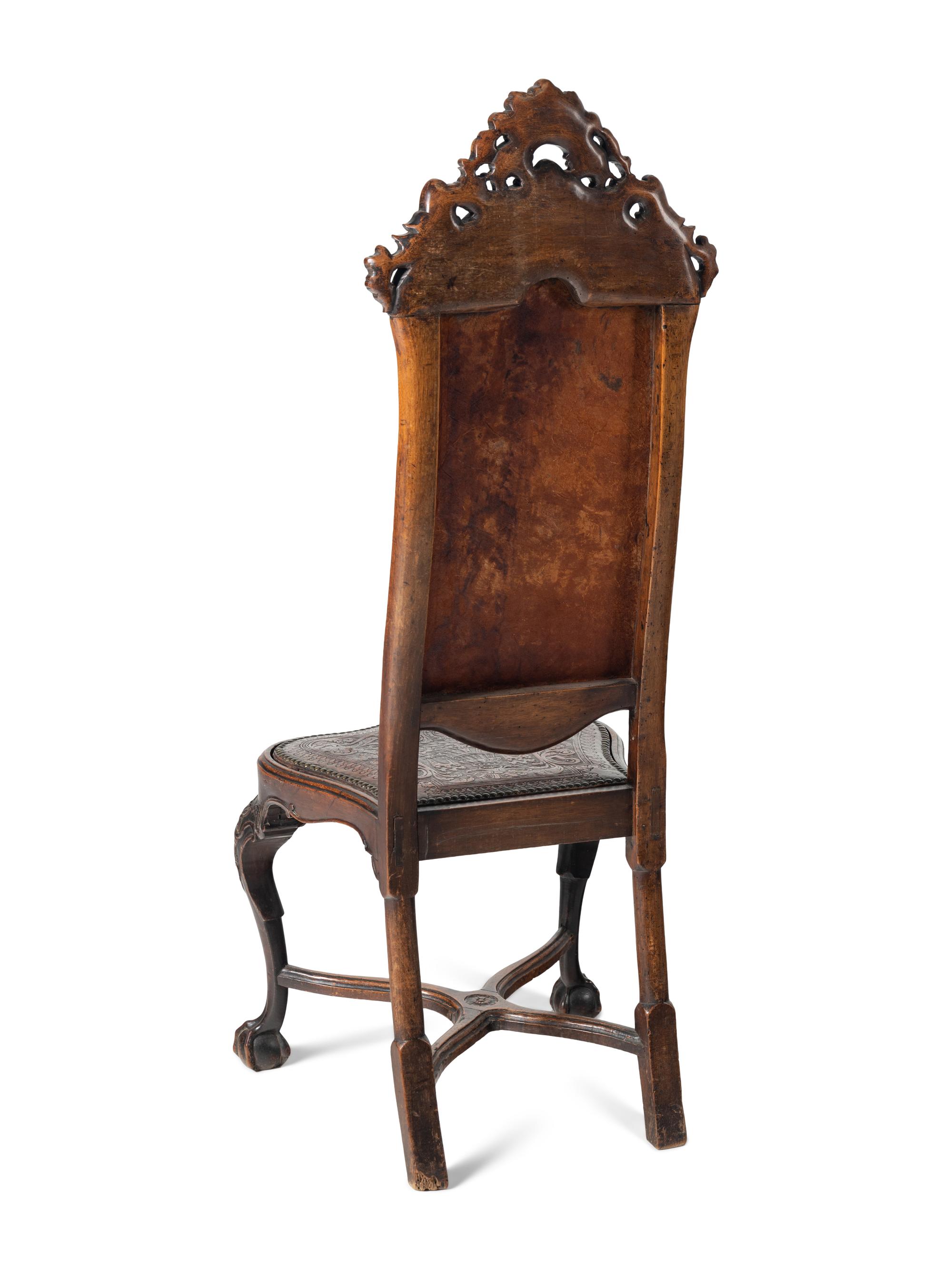 A Pair of Portuguese Carved Walnut and Tooled Leather Hall Chairs