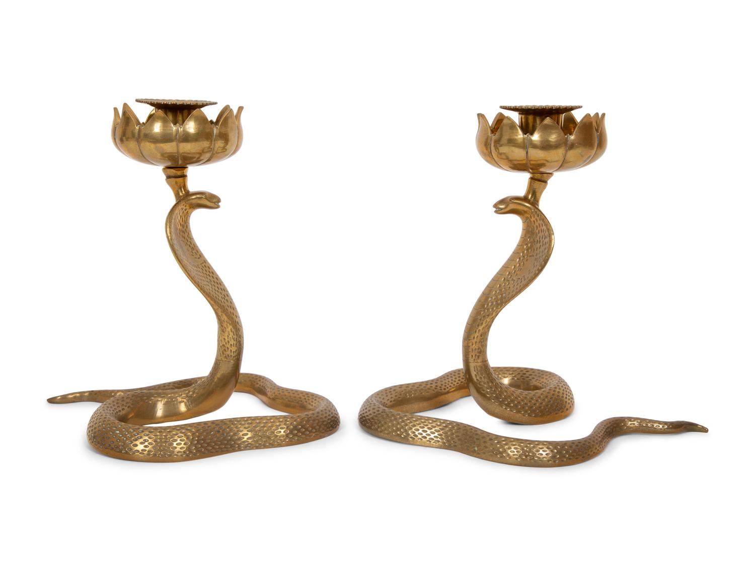 A Pair of Brass Cobra Candlesticks