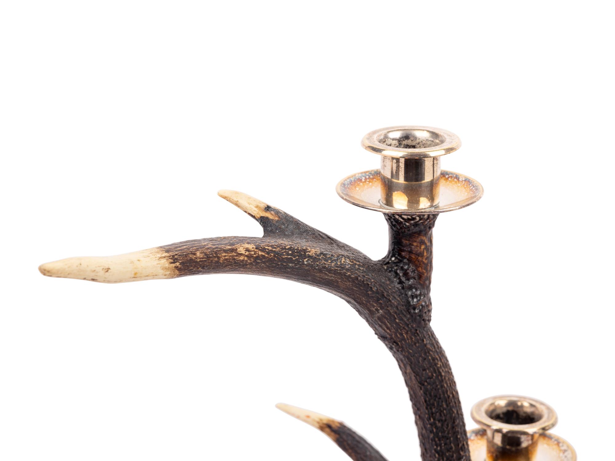 A Pair of Silvered Metal Mounted Antler Three-Light Candelabra