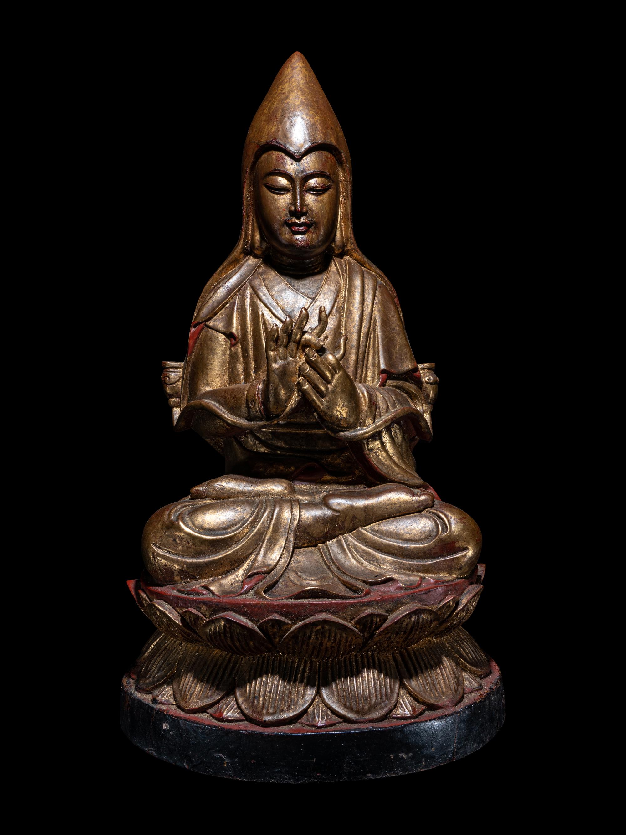 A Tibetan Gilt Lacquered Wood Figure of Tsongkapa