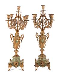 A Neoclassical Gilt Metal and Onyx Clock Garniture