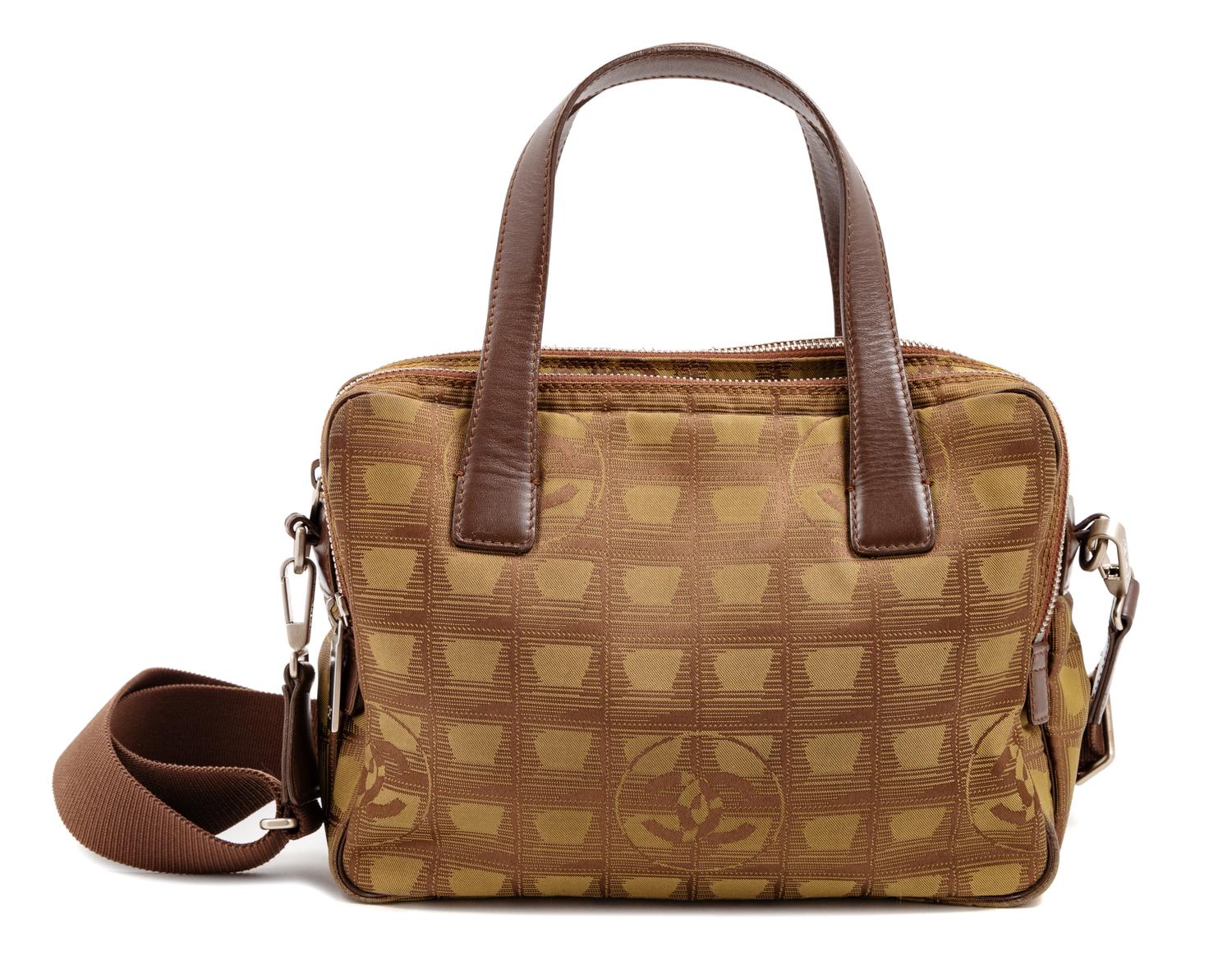 A Chanel Brown Nylon Travel Line Handbag, 8" H x 10" W x 4" D; Handle drop: 4.5".
